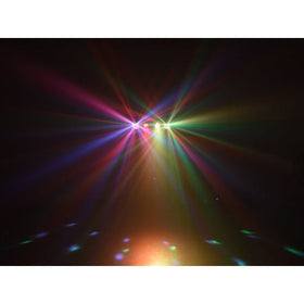 Eurolite LED KLS-120 FX ljusset som projicerar flerfärgade ljusstrålar i rött, grönt, gult och blått mot ett dansgolv i mörk miljö.